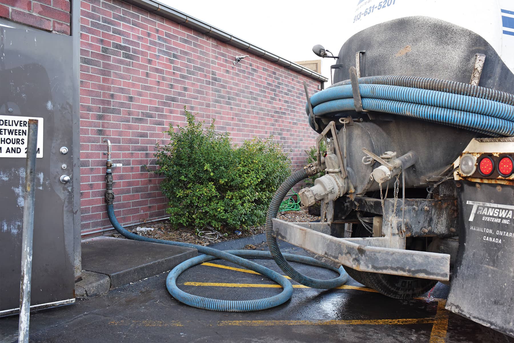 Pumper truck connected to external pumpout connection